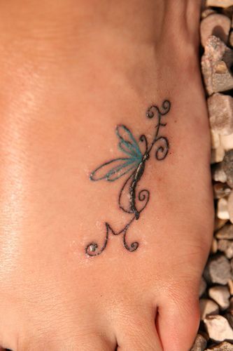 Love the Idea of incorporating kids initials my mom got a butterfly on her foot