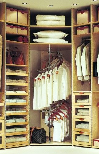 the all white wardrobe is weird but a the spiral rack is a good idea for finding