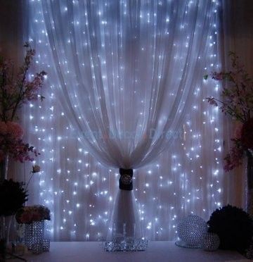 DIY Strings of mini-lights attached to a rod behind sheer fabric. With a little