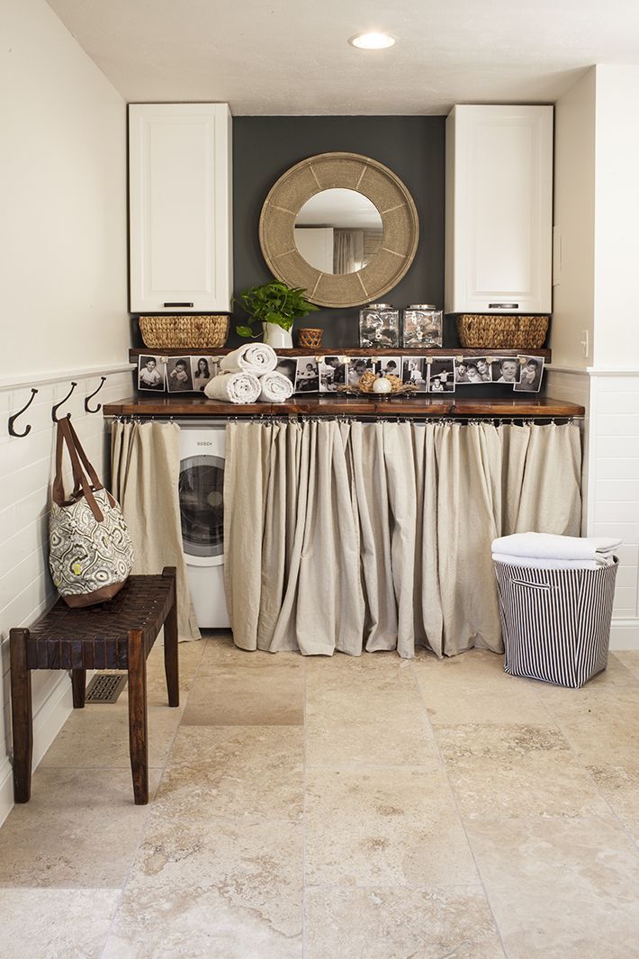 Super cute laundry nook. I love the wood countertop over the washer/dryer…the