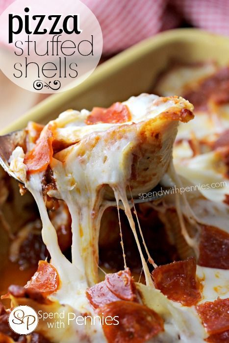 Pizza Stuffed Shells!  Delicious pasta shells stuffed with a lean beef & pepperoni filling and topped with gooey mozzarella