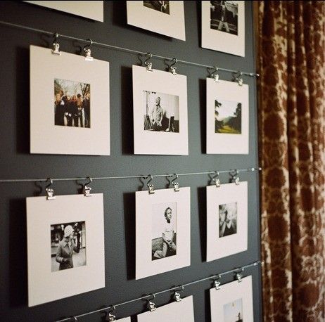 A similar idea is to use metal wires. Simply attach them to a wall and make sure theyre parallel. Then use some clips to hang the photos. Its a very sleek and simple way of displaying