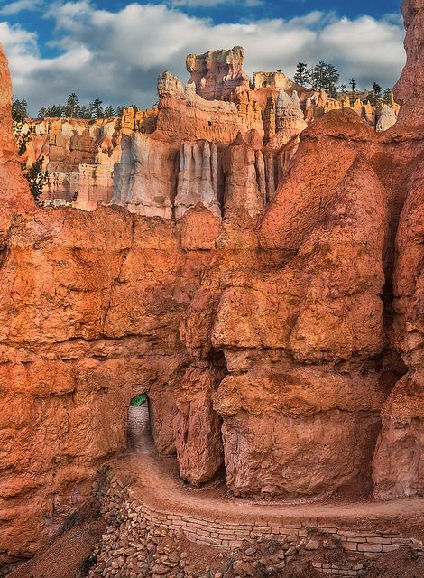 An opening carved through a Hoodoo on the Queens Garden pathway in Bryce Canyon National Park, Utah (by Ron