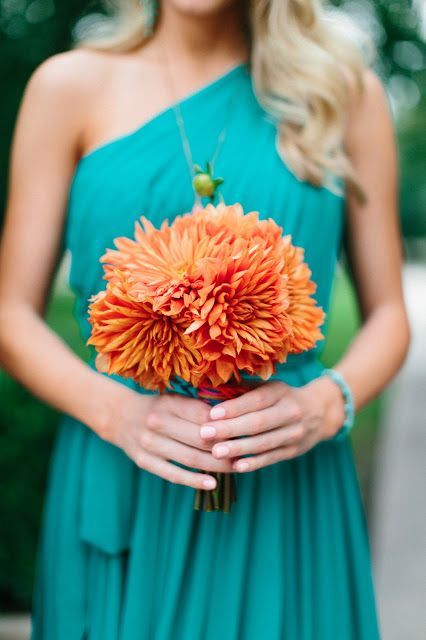 .bridesmaid color dress and orange flowers!
