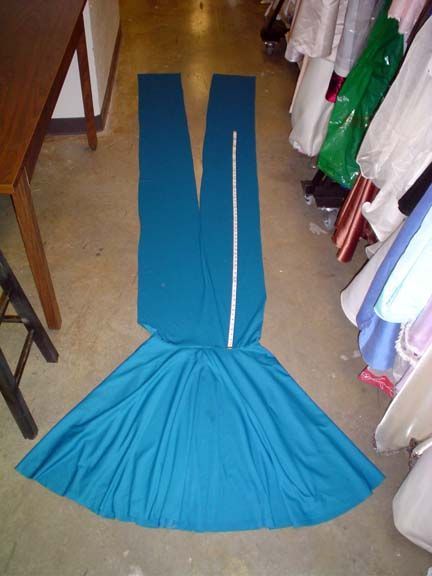 DIY convertible dress.  Minimal sewing with only 4 pieces (2 straps, 1 circular skirt, 1 waistband).  You could probably do this by