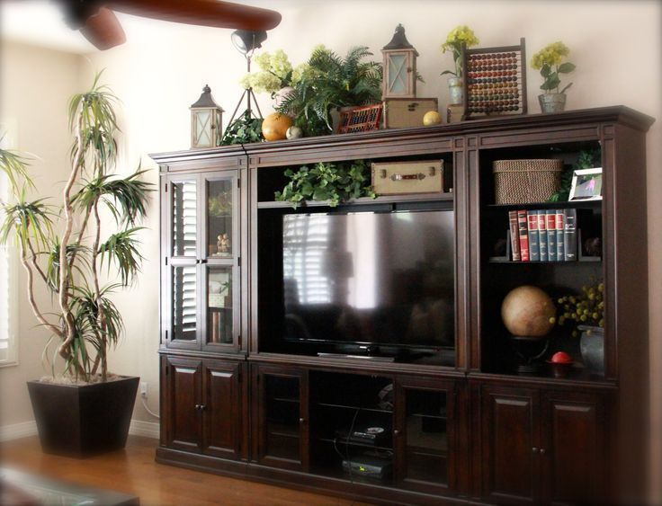 ideas for decorating the top of an entertainment center - Google
