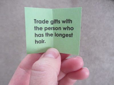 Some suggested gift-exchange instruction slips:  Trade gifts with… the person who has the longest hair the person to your right/left the