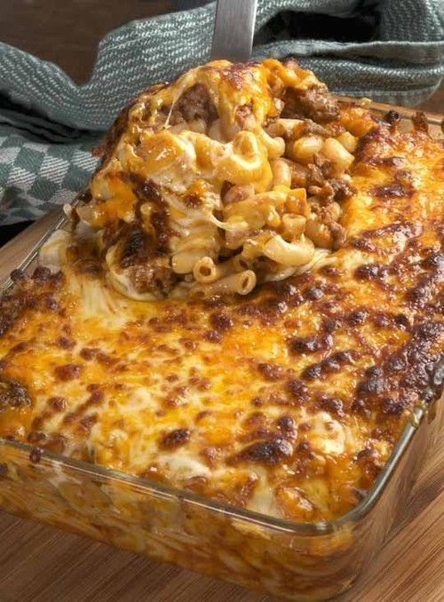 Cheesy Hamburger Casserole Ingredients: 	1 large onion, diced 	1 tablespoon canola oil 	salt 	black pepper 	oregano 	chopped garlic 	paprika (to taste) 	one 28-ounce can whole tomatoes, pureed in the