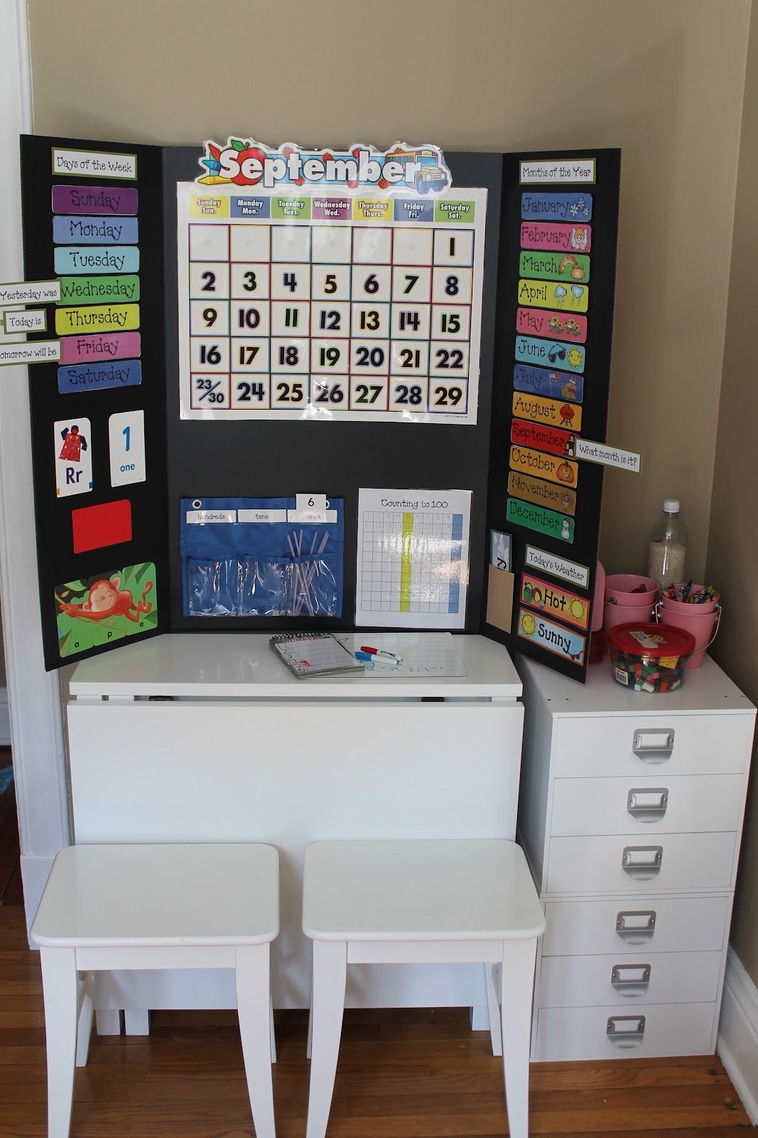 Great link to a cute DIY preschool board. I love how it can close up and doesnt make your home look like a classroom all the time :) great for