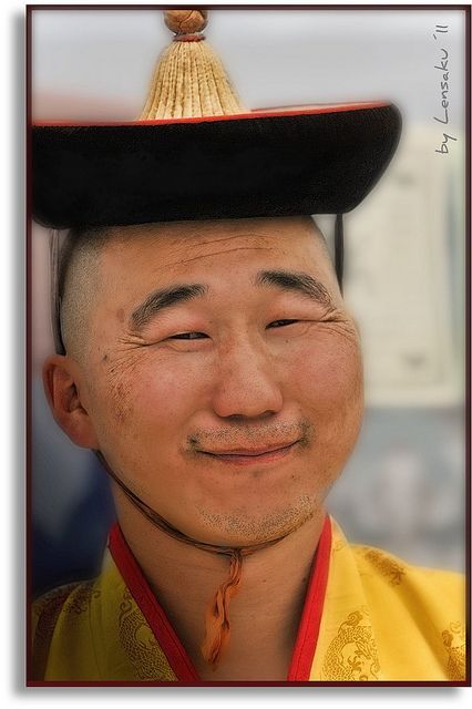 A Mongolian priest smiled for the photographer