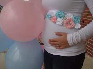 Absolutely adorable sash to wear for a gender reveal party with both white pink and blue flowers. Perfectly accentuate a pregnant