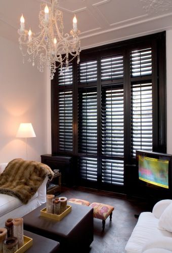 Black plantation shutters. Nice! Woonkamer – Jasno Shutters & Blinds  I would add a plant :)