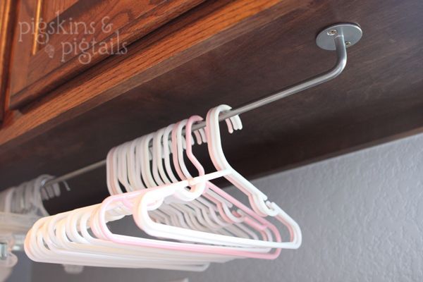 hanger organization under cabinets in laundry room – I like this, and have some IKEA rails on hand, too!