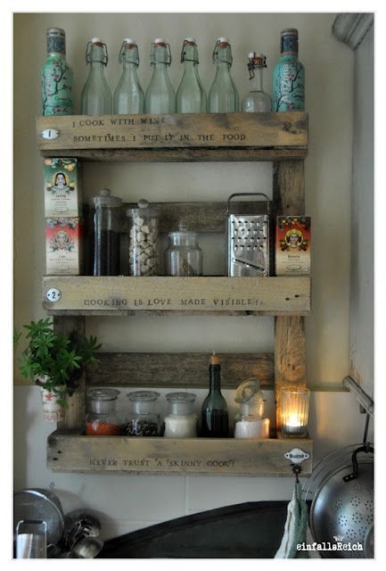 kitchen shelf of repurposed wood with phrases one the front.