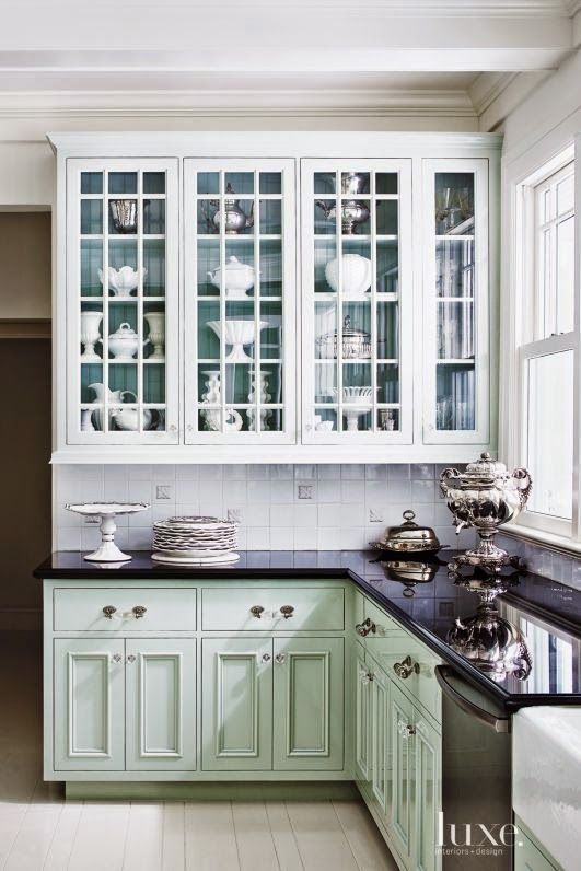 LOVE the color in back of the glass front cabinets