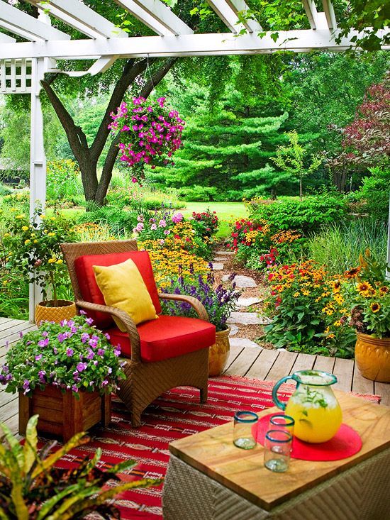 Make it Cozy  This small deck offers a great balance of comfy furniture, a sun-shielding pergola, and colorful surroundings. Its a