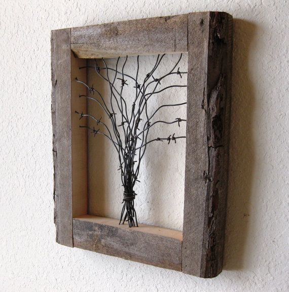 Reclaimed Barn Wood and Barbed Wire Tree Wall Art. This is about the ONLY thing barbed wire is good for. I could totally do this