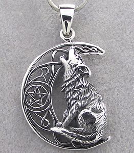 Something like this without the stuff in the moon, or a wolf print for charm bracelet tattoo