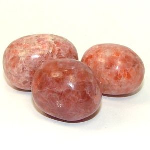 Sunstone energies: Protection, Healing, Love. Placed before a white candle, sunstone will spread protective energies throughout