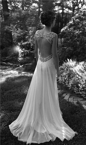 vintage lace wedding dress and beautiful hair style.  It really shows the interesting back.