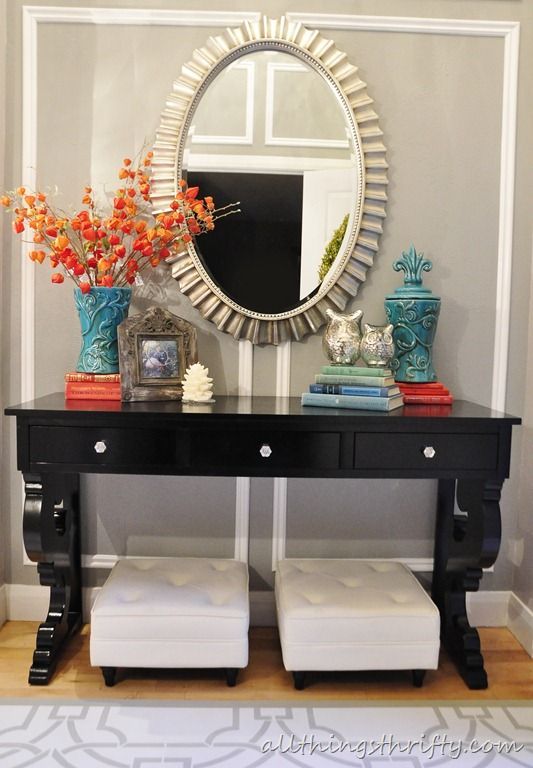 teal and orange entry…love the color, table and mirror! love it all