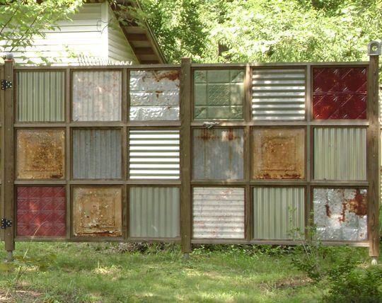 Awesome Recycled Fence using old ceiling tiles..great idea to get a privacy panel in the back!