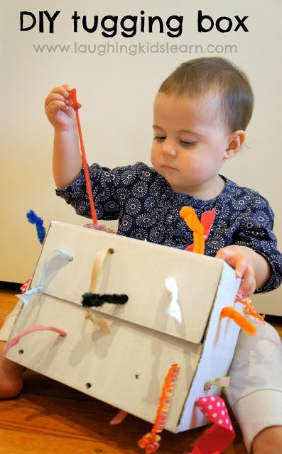 DIY Tugging Box for Young Toddlers ~ Fun Fine Motor, Sensory, and Cause and Effect Activity (From Laughing Kids Learn)