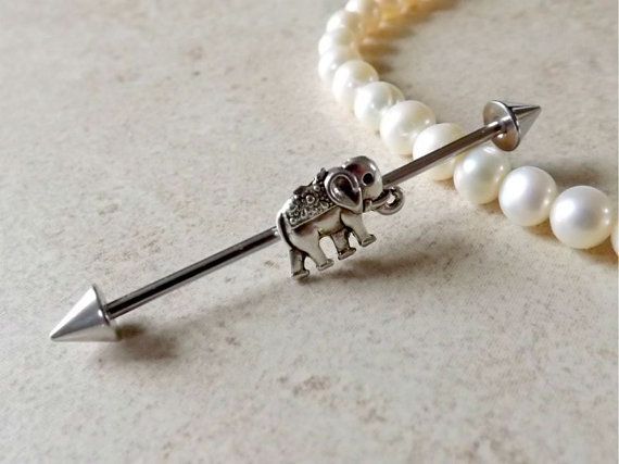 FREE SHIPPING ON ALL ADDITIONAL ITEMS!      Industrial Barbell with elephant charm. The elephant is approx 10mm x 10mm  This
