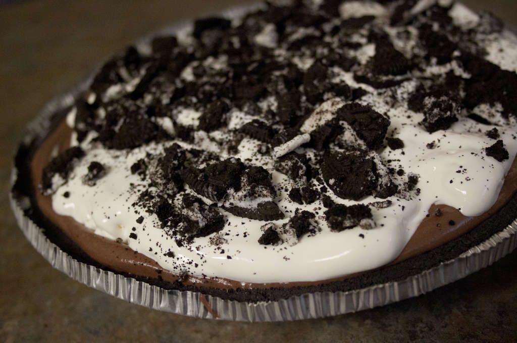 lazy college kid pie: prebaked oreo crust. chocolate pudding mixed with whipped cream. whipped cream. crushed oreos.