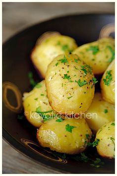 Potatoes baked in Chicken Broth, Garlic and Butter, SO GOOD! They get crispy on the bottom but stay fluffy inside. Chocked full of