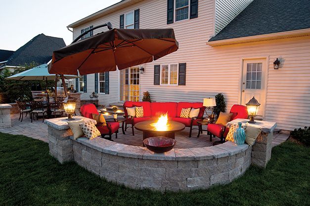 Family entertainment area, including stone seating and fire pit, created by Inchs Landscaping.