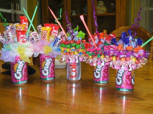 Soda can candy bouquets. Stick the straw directly in the foam first. Then just glue a styrofoam ball to the top of the can (a full