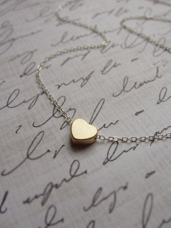 Tiny gold heart necklace  silver and gold by OliveYewJewels, $25.00… someone tell my husband. Ha
