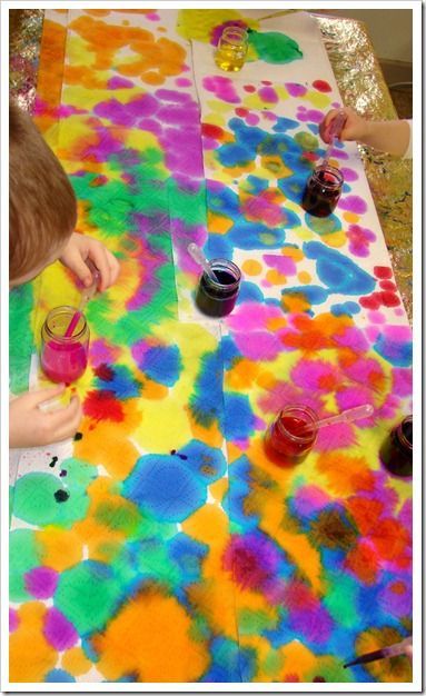 abstract art with droppers, liquid water colors, and paper towels – beautiful and great for fine motor development