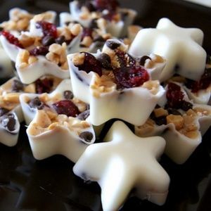 Bite-size chocolate bark ~melted white chocolate, sweet cranberries, toffee & dark chocolate chips in ice cube trays or candy