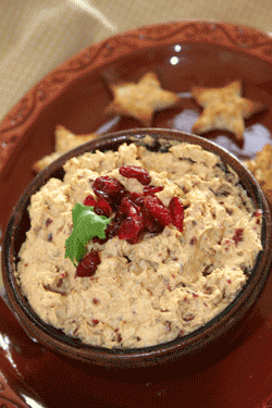 CRANBERRY WALNUT PUMPKIN DIP   –   8 ounces cream cheese   1 cup dried cranberries, plus a tablespoon for garnish   3/4 cup