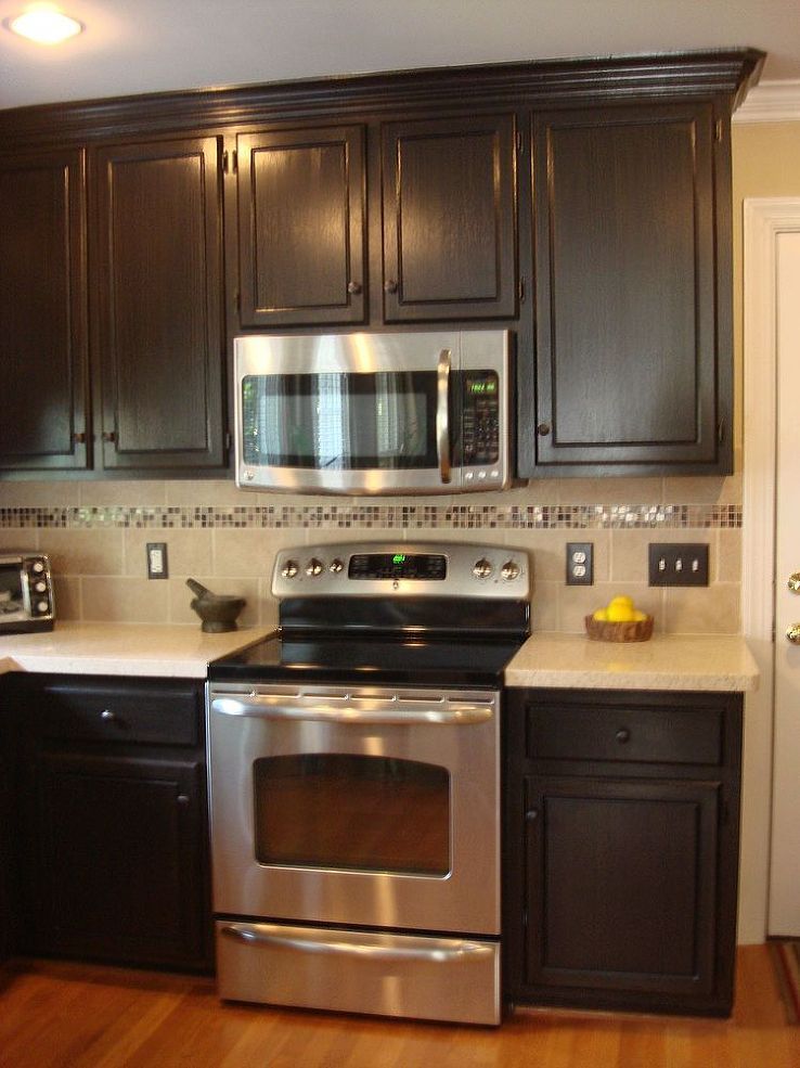 Painted and Glazed Kitchen Cabinets – Painted cabinets with a dark glazed finish completed this kitchen remodel. It feels so much