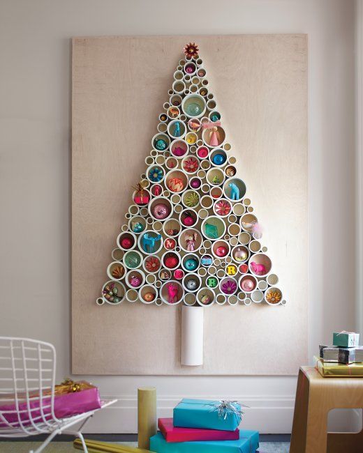 christmas tree with pvc tubing filled with all manner of bright and kitch ornaments