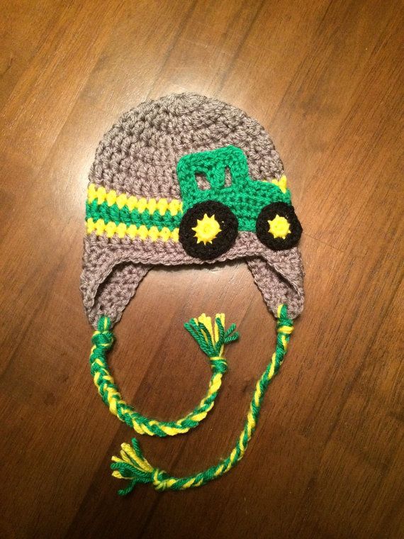 Crochet John Deere tractor baby hat with ear flaps.