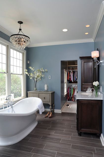 Mr dream bathroom – wood grain tile, chandelier, cozy blue walls, gorgeous soaker tub!