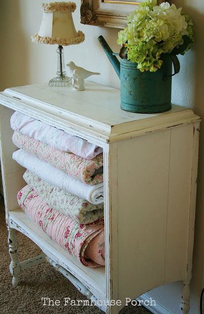 Take the drawers out of an old nightstand or small dresser and use to store quilts practically but visibly. ♥