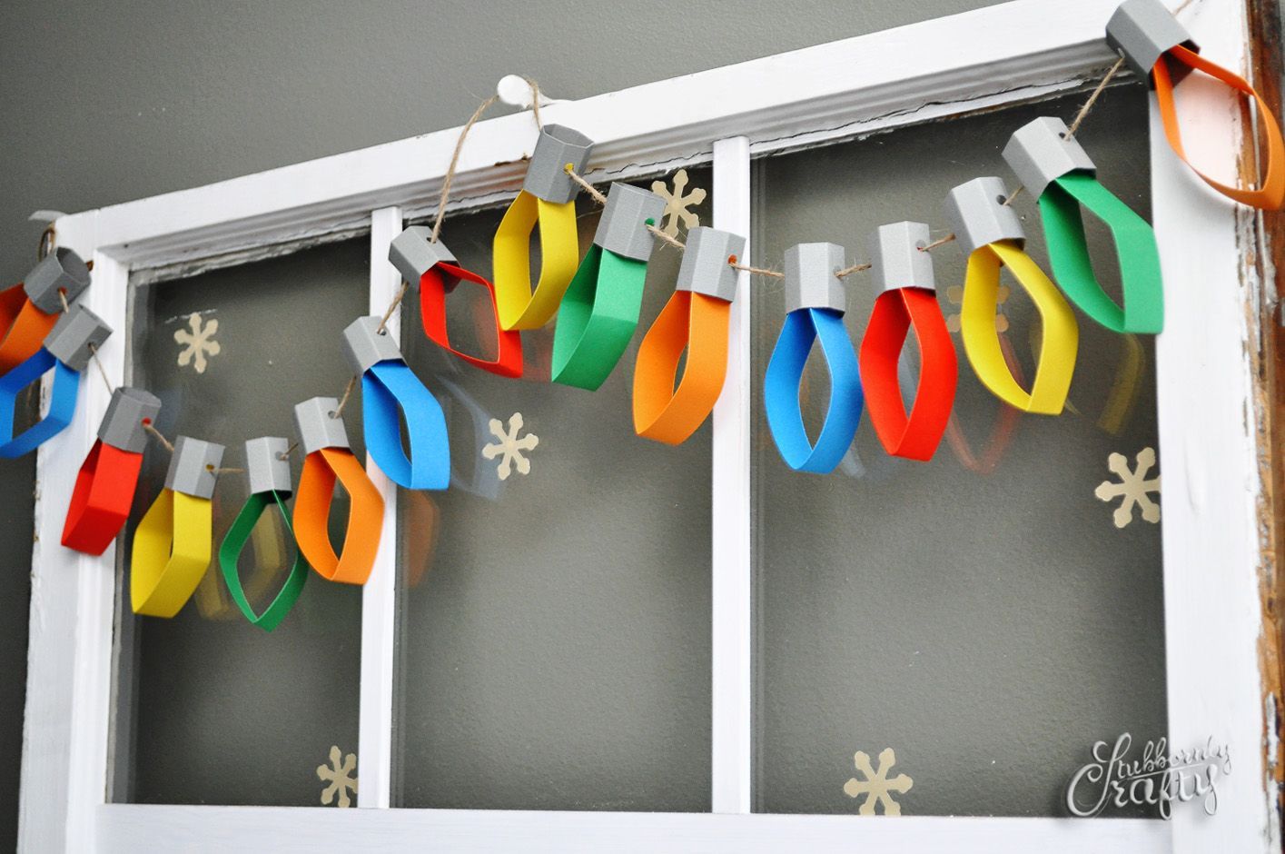 This Christmas lights garland is a simple project that will level up your holiday decor and maybe even give the kids something to