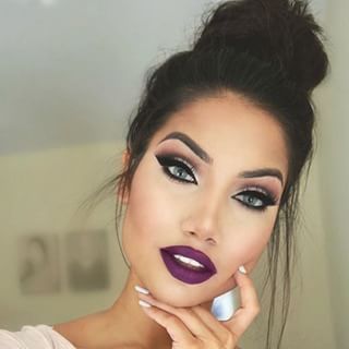 Absolutely love this deep purple lipstick with a top bun and a light colored outfit!!