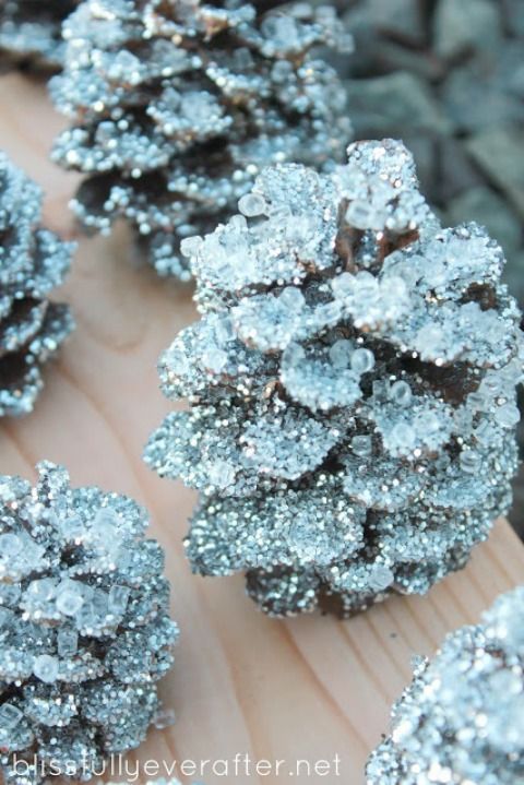 DIY Sparkly Pinecones- These would be a perfect festive decor touch for a winter wedding!