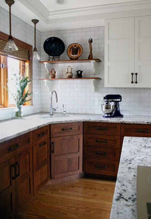 evaluating the task of remodeling the kitchen.  Really liking the upper white cabinets with the lower dark wood.  From