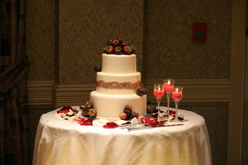 Elegant wedding cake table decor with chocolate covered fruits and ... -   Cake Table Décor Ideas