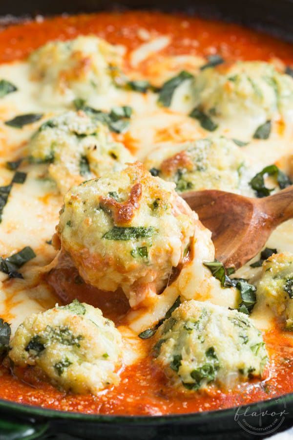 Spinach Chicken Parmesan Meatballs are baked in a creamy tomato sauce to create a meal that everyone will love!