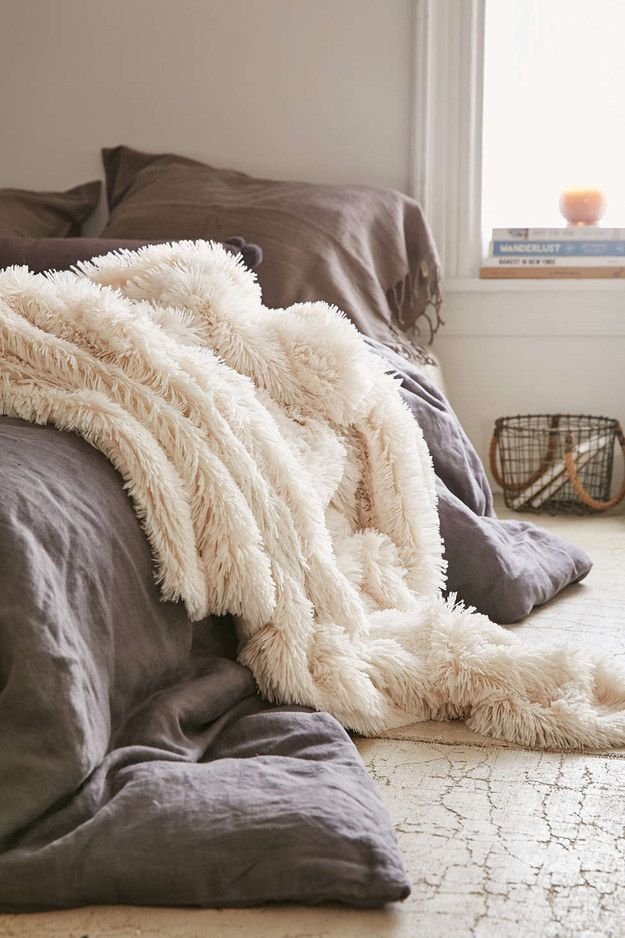 This faux fur throw—$79 | 19 Insanely Cozy Accessories That Will Make You Never Want To Leave Your Bed