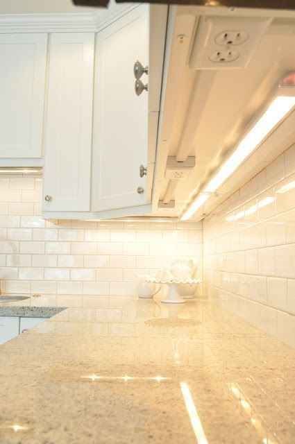 You could also install your outlets underneath your kitchen cabinets so they don’t interfere with the backsplash.