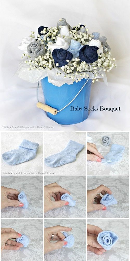 Baby Socks Flower Bouquet Tutorial – could use square boxes wrapped to look like baby blocs in place of pail for each table